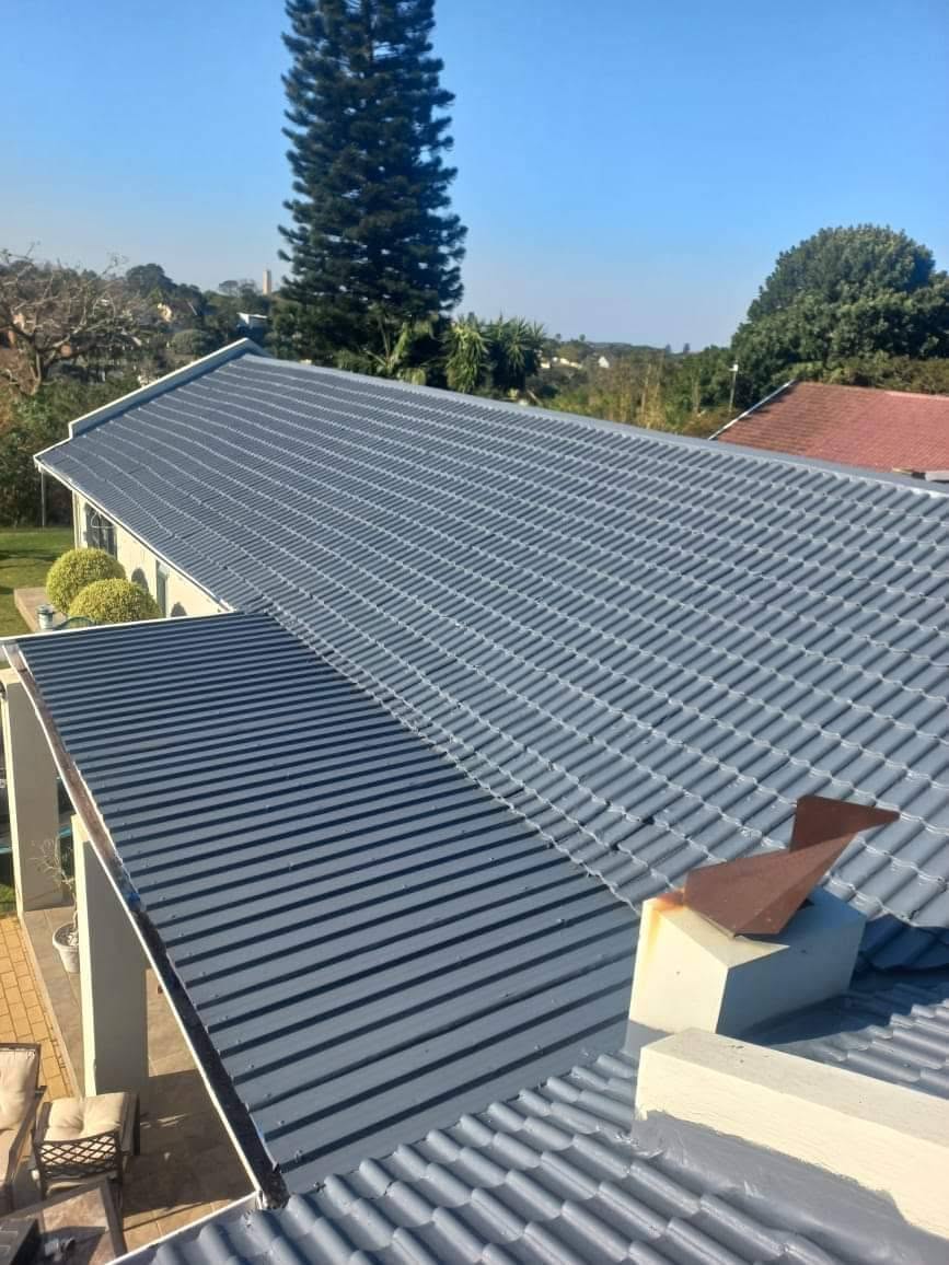 Large residential roof finished with grey waterproof roof coating by Border Rubberising