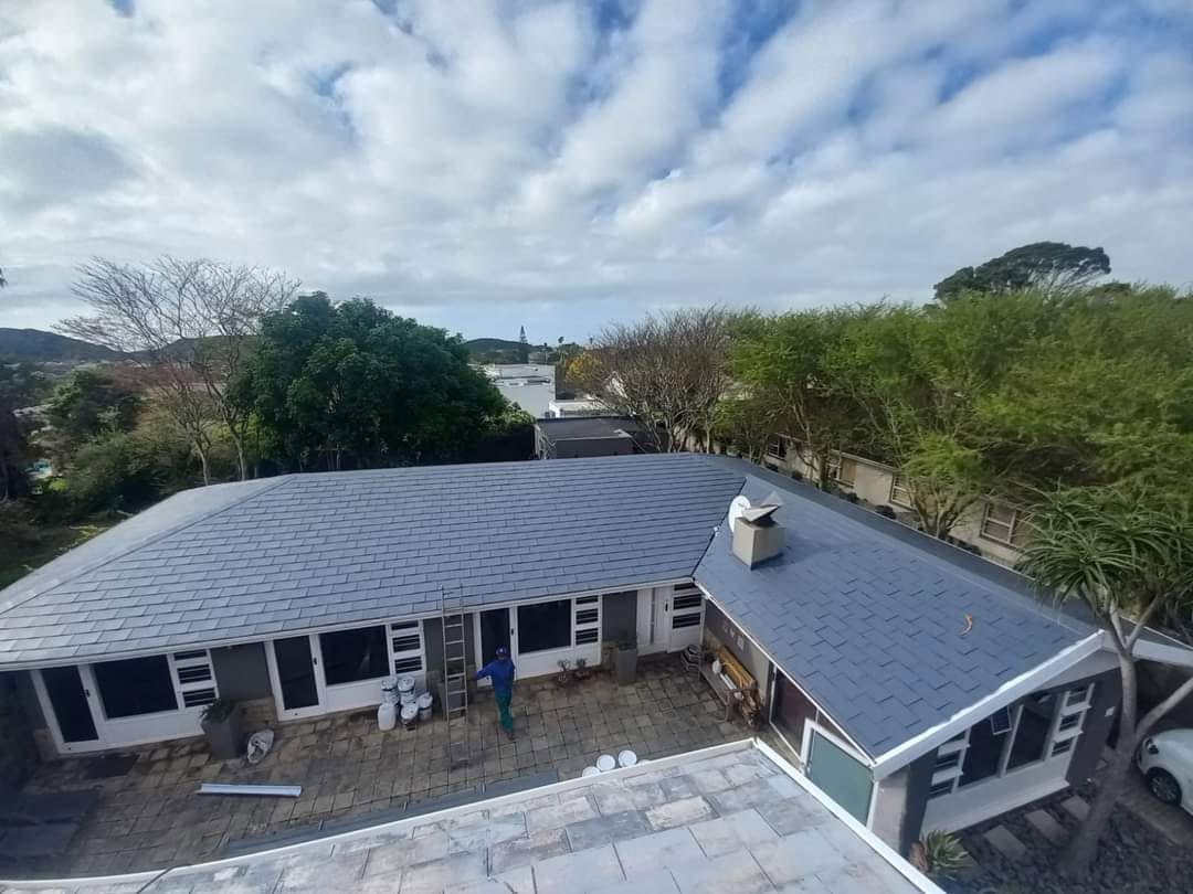 Large residential roof completed with grey waterproof rubberising coating