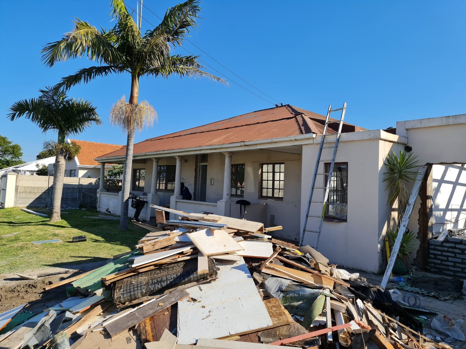Residential roof and property before roof restoration work