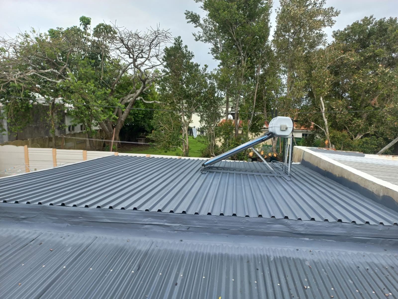 Roof surface preparation and cleaning before waterproof coating application